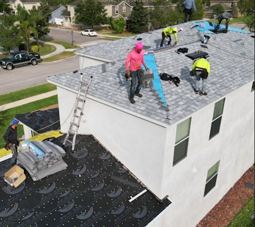 Roofing contractor team repairing a residential roof in Apopka, Florida